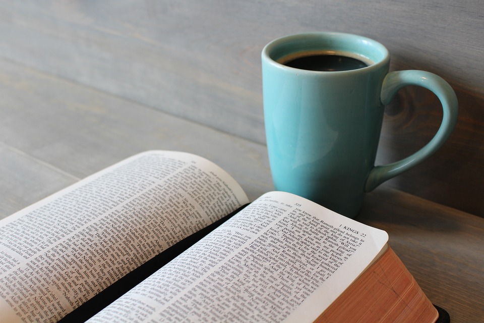 bible with blue coffee cup